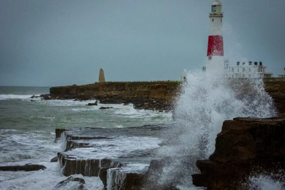time-lapse photography of waves splashing on seawall