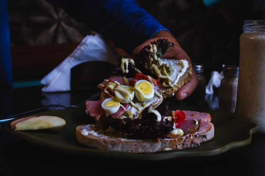person holding piece of cake